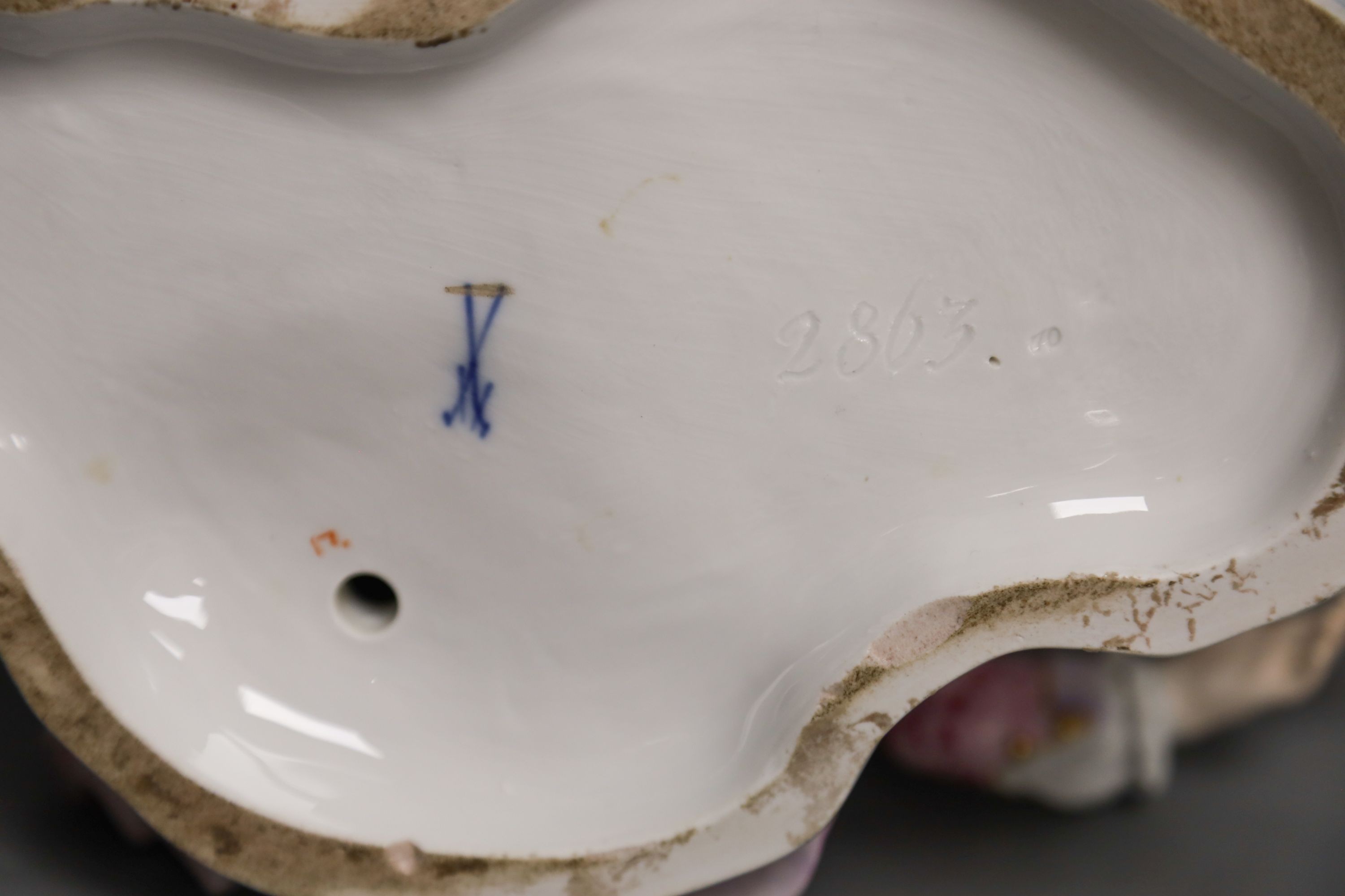 A 19th century Meissen figural sweetmeat dish, incised number 2863 30cm